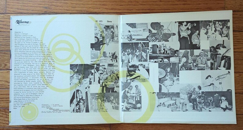 May include: A black and white photo album with a yellow and white swirl design on the cover. The album features photos of a band performing on stage and in the studio. The album cover includes the text "Aluma" and "62 1003 Stereo".