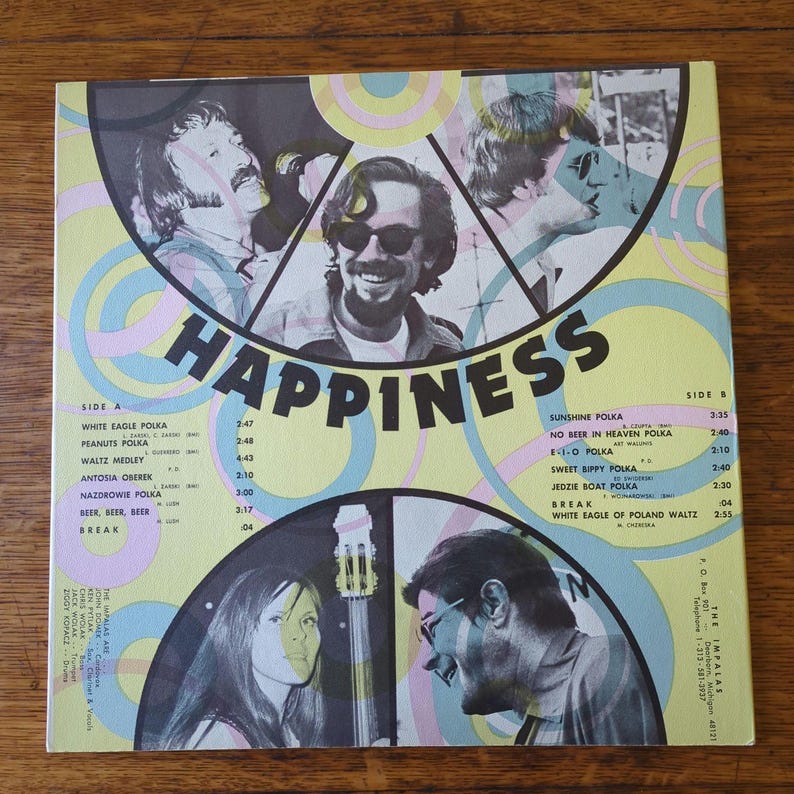 May include: A vintage vinyl record album cover with a psychedelic design featuring three people and the word "HAPPINESS" in large, bold letters. The album is titled "Happiness" and features a tracklist on both sides of the record.