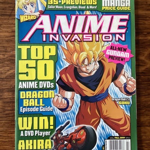 May include: A magazine cover titled "Anime Invasion" featuring a large illustration of a character from Dragon Ball Z. The cover includes text such as "Top 50 Anime DVDs" and "Dragon Ball Episode Guide". The magazine is dated Fall 2001.
