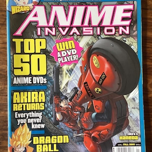 May include: A magazine cover for Anime Invasion, featuring a red motorcycle with a character riding it. The cover also features a character from Dragon Ball Z and the text "Top 50 Anime DVDs".