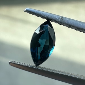 0.85 Carat Dark Peacock Sapphire: Marquise Cut Blue Green Gemstone