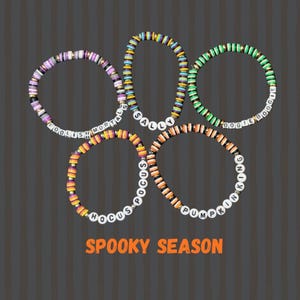 May include: Five colorful beaded bracelets with white letter beads spelling out phrases like "Foolish Mortals" and "Sally". The bracelets are in shades of purple, yellow, orange, green, and black. The words "Spooky Season" are in orange text.