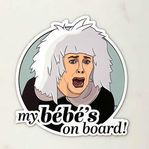 May include: A white sticker with a cartoon image of a person with white hair and a shocked expression. The text "my bébé's on board!" is written in black below the image.