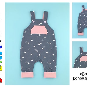 May include: A grey and pink baby overall with white heart print. The overall has adjustable straps and a pink pocket. The overall has a pink trim around the legs. The text "eBook Schnittmuster" is visible in the image.