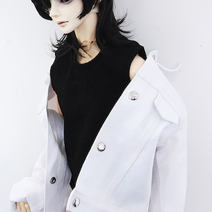 May include: A white denim jacket with a black sleeveless shirt underneath. The jacket has a button closure and a collar.