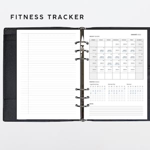 May include: A black fitness tracker with a calendar, weight tracker, and monthly goals sections. The calendar is for January 2023.