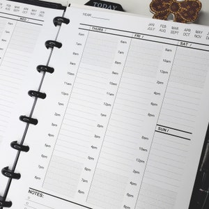 May include: A black and white planner with a daily schedule for the week. The planner has a black cover with the word "TODAY" printed on it. The planner is open to the Thursday, Friday, Saturday, and Sunday pages. Each page has a column for the time of day, from 6am to 8pm.