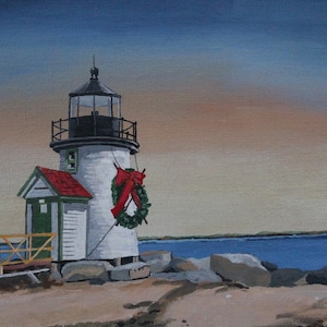 May include: A white lighthouse with a red roof and a green door, decorated with a green wreath and a red bow, stands on a rocky shore with a wooden walkway leading to it. The sky is a soft blue and orange.
