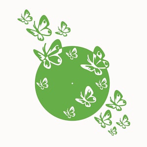 May include: A green circle with white butterfly cutouts. The circle is surrounded by more white butterflies.