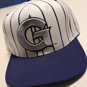 Mitchell & Ness Georgetown Hoyas GT Snapback Hat White Navy Silver Green Brim