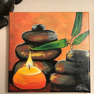 May include: A painting of a stack of smooth, gray stones with a green leaf on top. A lit orange candle sits in front of the stones. The background is a warm orange color.