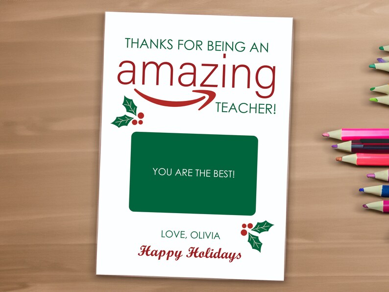 May include: A white card with a green and red holly design. The card says "Thanks for being an amazing teacher!" and "You are the best!" with a space for a gift card. The card also says "Love, Olivia" and "Happy Holidays".