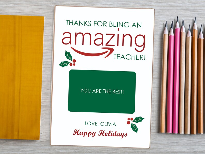 May include: A white card with a red and green holly design. The card says "Thanks for being an amazing teacher!" and "You are the best!" with a space for a gift card. The card also says "Love, Olivia" and "Happy Holidays".