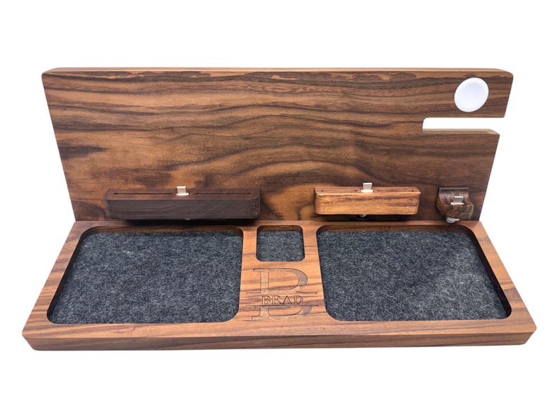 Minimalist desk with handcrafted Apple dock organizing iPhone, iPad, Apple Watch, and AirPods