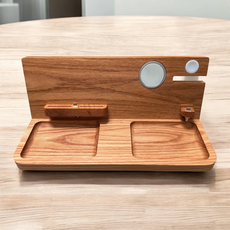 Close-up of magnetic lock, cable grooves, tray, and walnut wood on handmade Apple dock