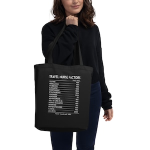 May include: Black tote bag with white text that reads "Travel Nurse Factors" and lists personality traits with a percentage value next to each. The text at the bottom reads "Daily Value May Vary."
