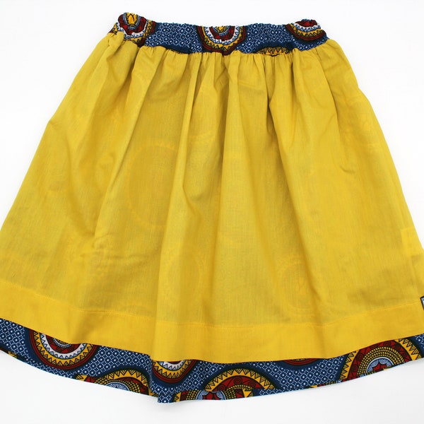 Jupe réversible enfant (6/8 ans) - Voile de coton jaune d'or et wax multicolore sur fond bleu