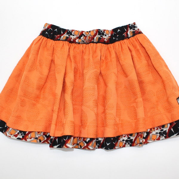 Jupe réversible enfant (4 ans) - Jacquard orange uni et wax au motif multicolore