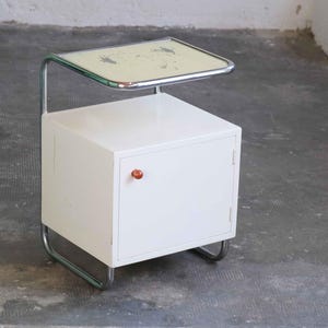 White Art Deco tubular steel bedside table with glass top