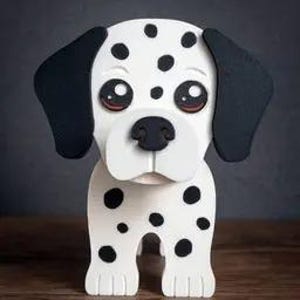 May include: A wooden Dalmatian dog figurine with a white body and black spots. The dog has large, expressive eyes, black ears, and a black nose. The figurine is standing on a wooden surface. The brand name "TIMUX" is at the bottom.