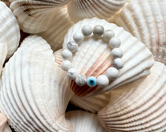 Manifest that inner peace! Greek evil eye howlite ring.