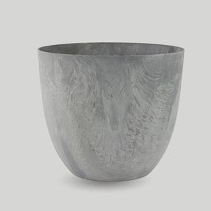 May include: A grey, marbled-effect ceramic bowl with a wide opening and rounded shape. The bowl has a smooth, textured surface and a neutral colour palette, suitable for various home decor styles.