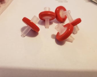 May include: Five red and white plastic filter caps with a clear plastic tube attached to each cap.