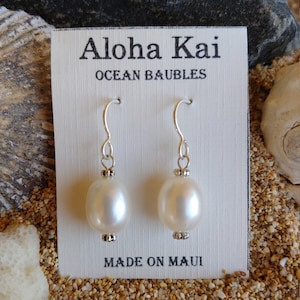 White freshwater pearl earrings with 10 x 12 mm pearls and silver bead detail