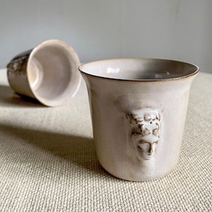 Handmade ceramic espresso cup with embossed Aphrodite relief, inspired by Greek mythology goddess design, green glaze finish, 100ml (3.4 oz) capacity, unique coffee mug for espresso lovers and mythology gift.