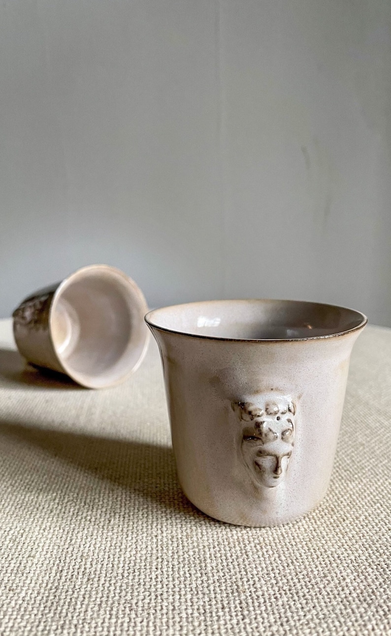Handmade ceramic espresso cup with embossed Aphrodite relief, inspired by Greek mythology goddess design, green glaze finish, 100ml (3.4 oz) capacity, unique coffee mug for espresso lovers and mythology gift.