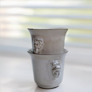 Handmade ceramic espresso cup with embossed Aphrodite relief, inspired by Greek mythology goddess design, green glaze finish, 100ml (3.4 oz) capacity, unique coffee mug for espresso lovers and mythology gift.