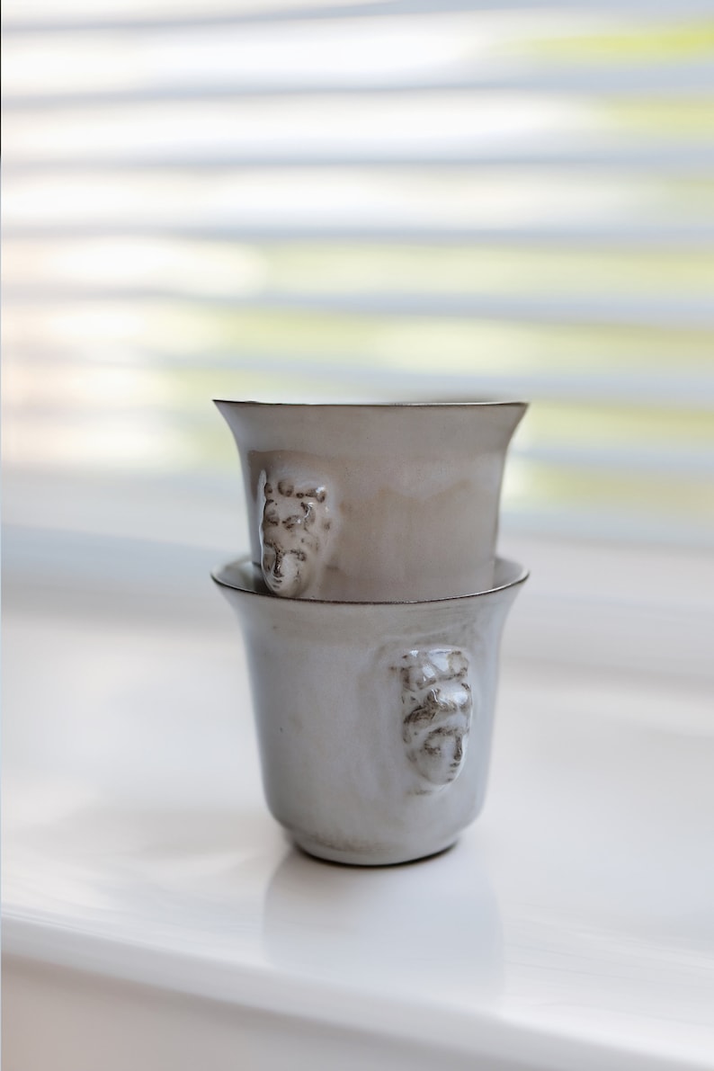 Handmade ceramic espresso cup with embossed Aphrodite relief, inspired by Greek mythology goddess design, green glaze finish, 100ml (3.4 oz) capacity, unique coffee mug for espresso lovers and mythology gift.