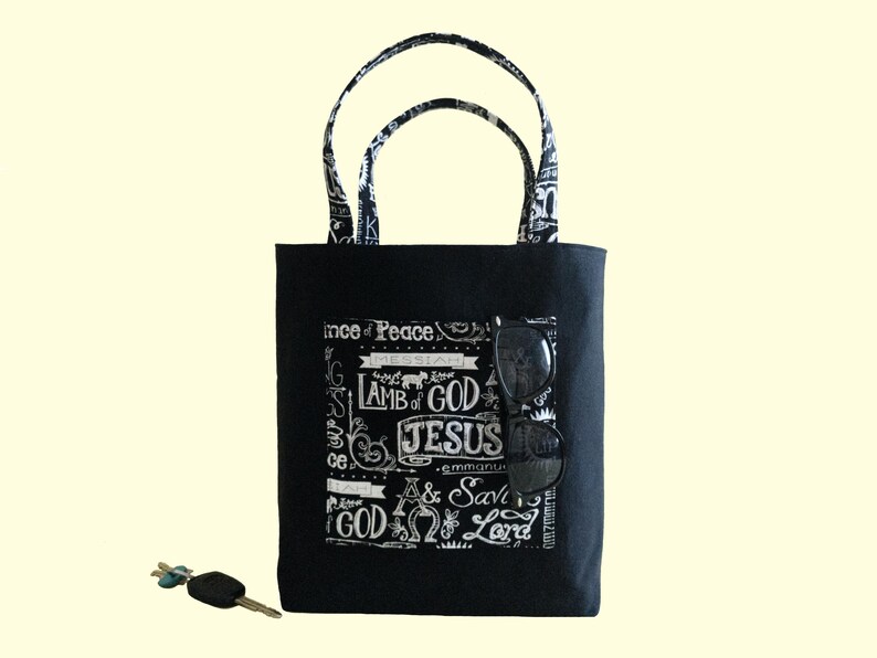 This christian Tote Bag is large enough for womens Bible study books. It is black canvas with cotton fabric pockets, lining and double handles. The boxed bottom bag is reinforced to be sturdy and strong.