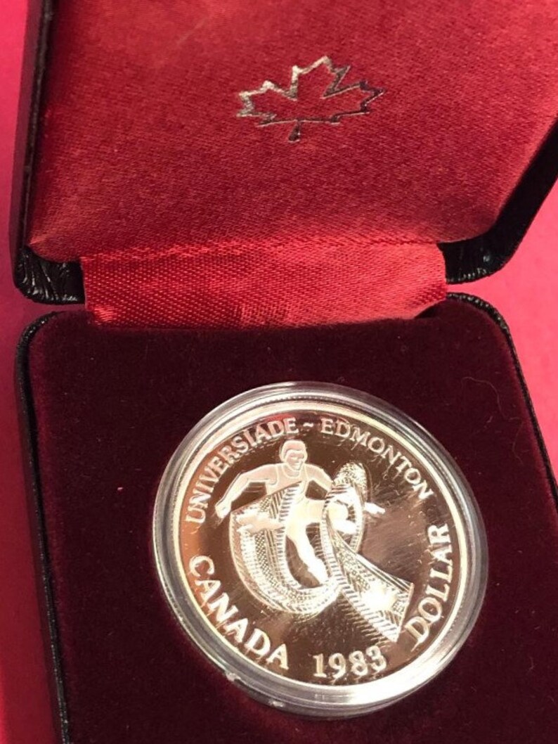 WORLD UNIVERSITY GAME High Grade Nice Coin Canada 1983 Silver Dollar PROOF UNC