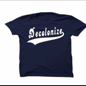 May include: A navy blue t-shirt with a white baseball-style font that says "Decolonize".