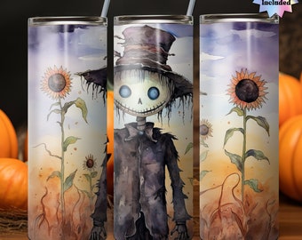 May include: A stainless steel tumbler with a watercolor design of a spooky scarecrow with a top hat and sunflowers. The background is a watercolor wash of purple, blue, and yellow.