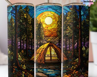 May include: A stained glass style tumbler design featuring a tent in a forest with a sunset in the background. The design is in shades of blue, green, yellow, orange, and brown.
