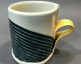 Green stripes with yellow handle