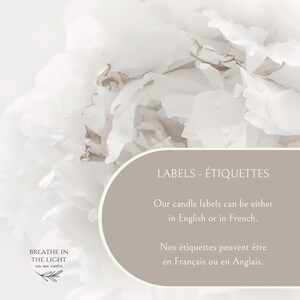 May include: A soft, neutral-toned image featuring white flowers and text. The text reads "LABELS - &Eacute;TIQUETTES" and states that candle labels are available in English or French. The bottom left corner displays the text "BREATHE IN THE LIGHT soy wax candle."