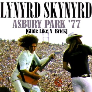 May include: A concert poster for Lynyrd Skynyrd's Asbury Park '77 concert, featuring a photo of a guitarist playing in front of a large crowd. The poster also includes the text "Glide Like A Brick".