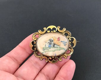 Antique Victorian gilt metal brooch with hairwork embroidery panel