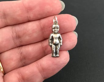 Antique puffy silver Frozen Charlotte doll charm or pendant