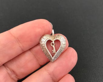Small vintage 1970s sterling silver Key to My Heart pendant