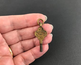Antique advertising pocket watch key, C F Snelson Alfreton