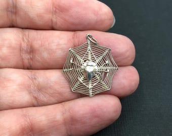 Vintage sterling silver web with spider charm or pendant