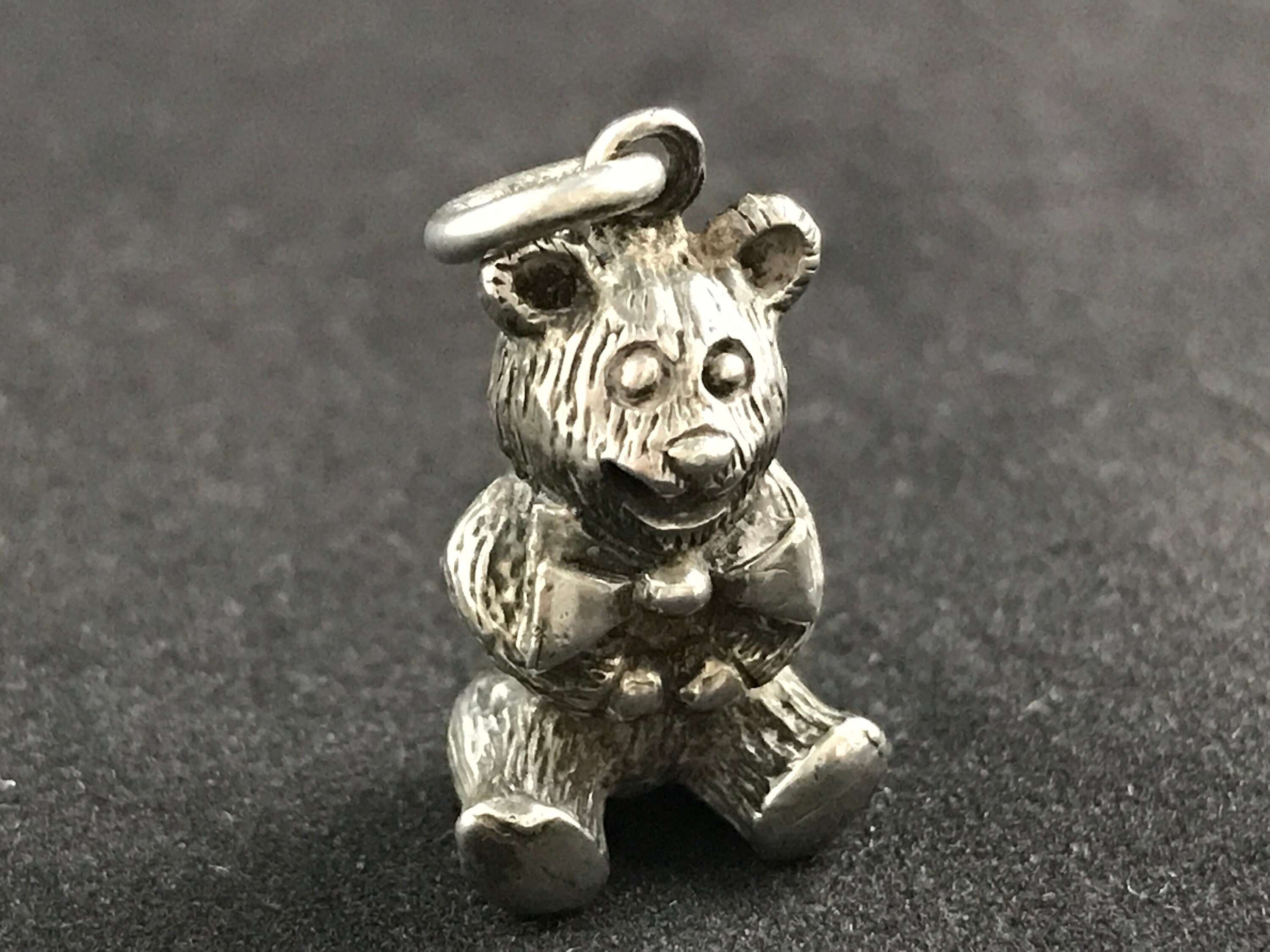 teddy bear with purple bow tie