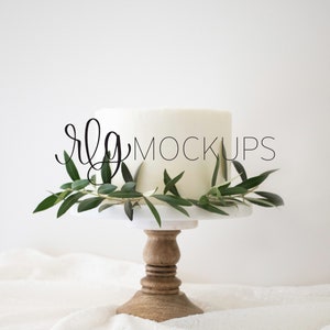 White Cake with olive branches styled stock photo- Cake Topper Mockup photo