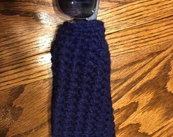 May include: A dark blue knitted sunglasses case with a pair of sunglasses inside.