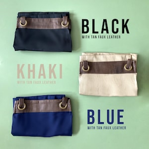 May include: Three fabric bags with tan faux leather accents. The bags are folded and displayed on a green background. The bags are labeled "Black with tan faux leather", "Khaki with tan faux leather", and "Blue with tan faux leather".