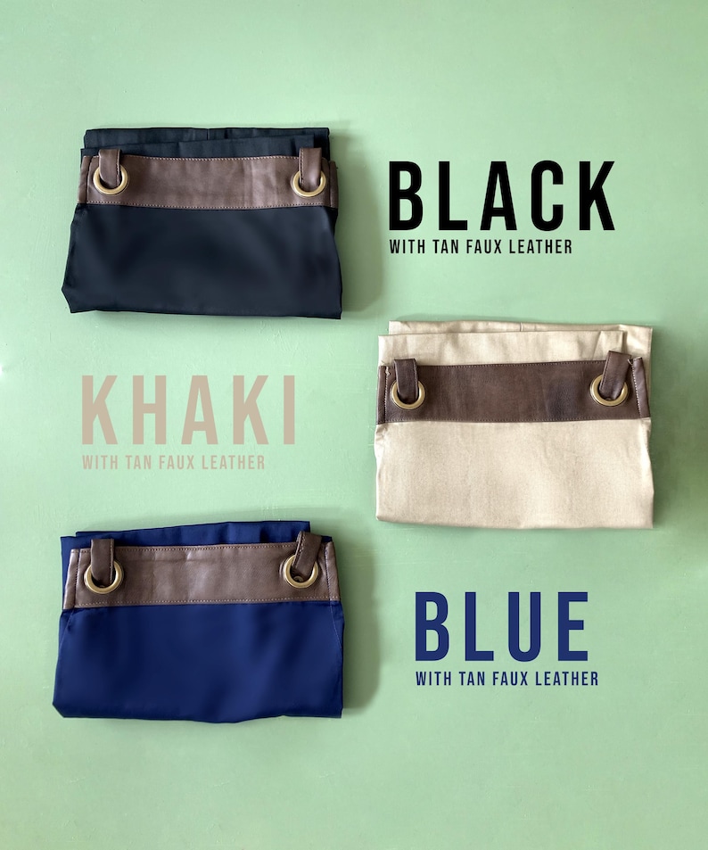 May include: Three fabric bags with tan faux leather accents. The bags are folded and displayed on a green background. The bags are labeled "Black with tan faux leather", "Khaki with tan faux leather", and "Blue with tan faux leather".